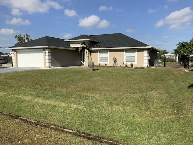 view of front facade featuring a garage and a front lawn