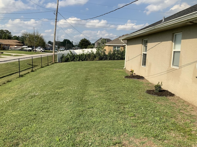 view of yard with a fenced backyard