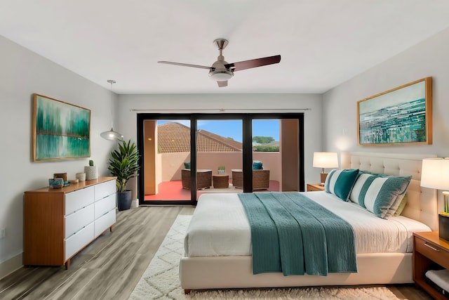 bedroom featuring access to exterior, ceiling fan, and light hardwood / wood-style floors