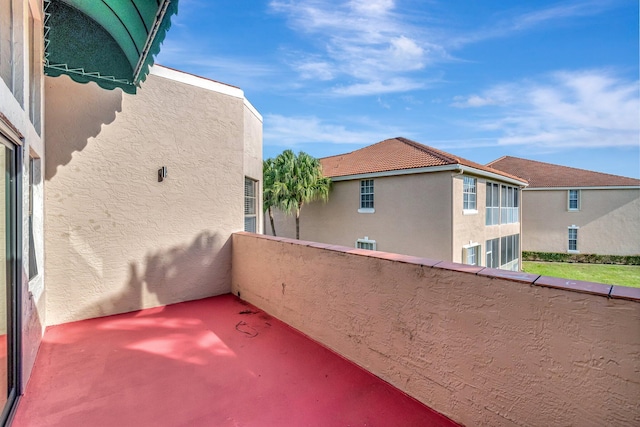 view of patio featuring a balcony