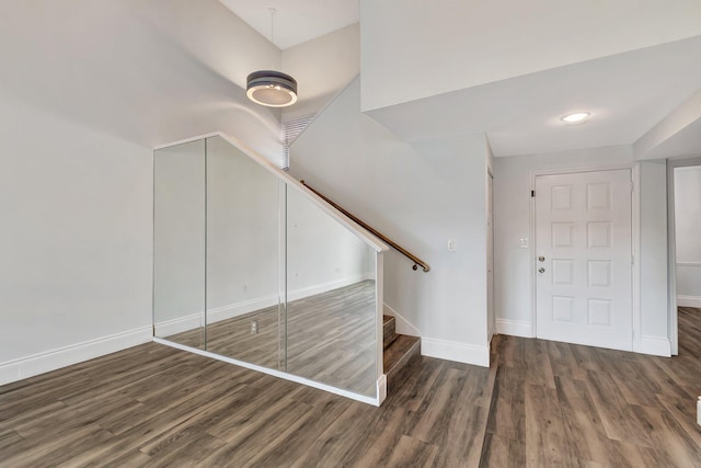 stairway featuring hardwood / wood-style floors