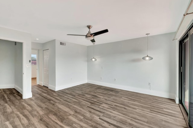 unfurnished bedroom featuring hardwood / wood-style floors and ceiling fan