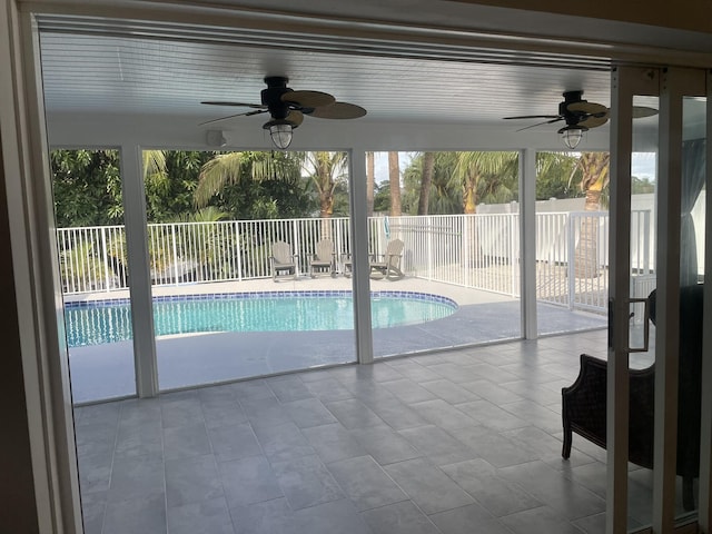 view of pool featuring ceiling fan