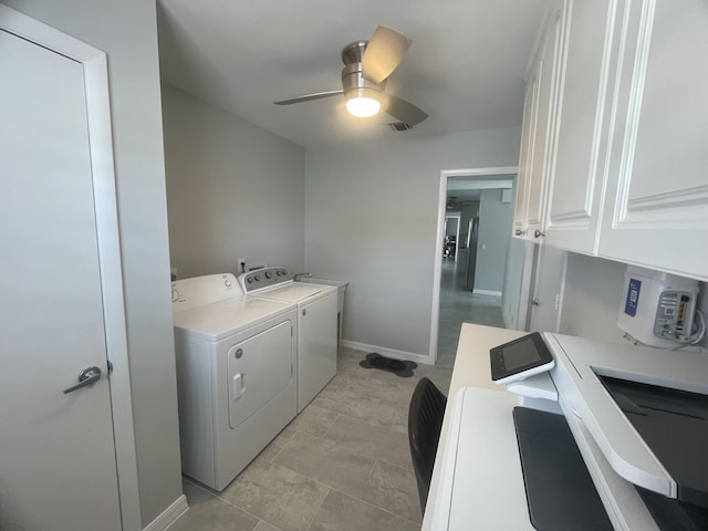 laundry area with cabinets, washing machine and dryer, and ceiling fan