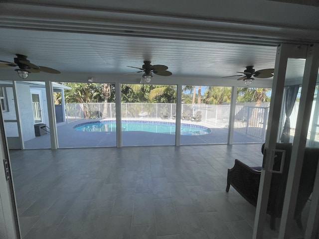 view of swimming pool with ceiling fan