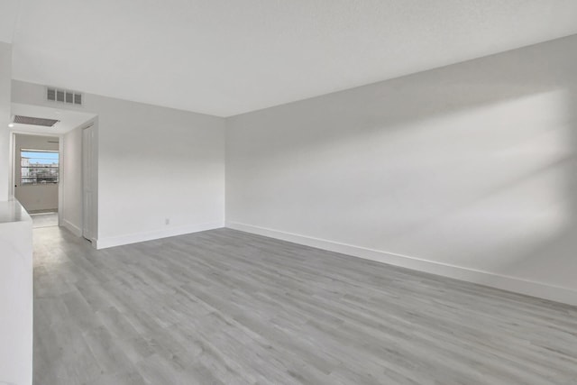 unfurnished room featuring light hardwood / wood-style floors