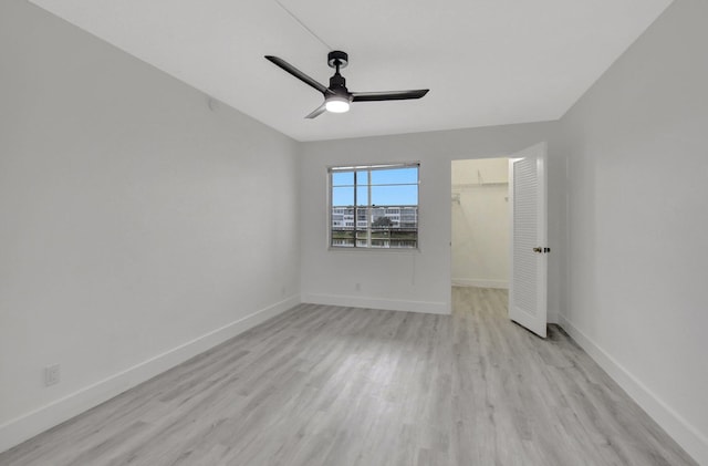 unfurnished room with ceiling fan and light hardwood / wood-style floors