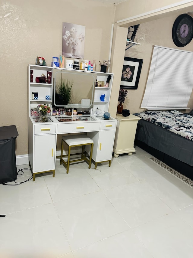 bedroom featuring light tile patterned floors