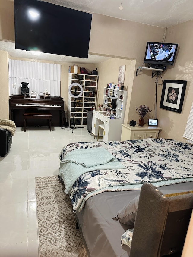 bedroom featuring light tile patterned floors