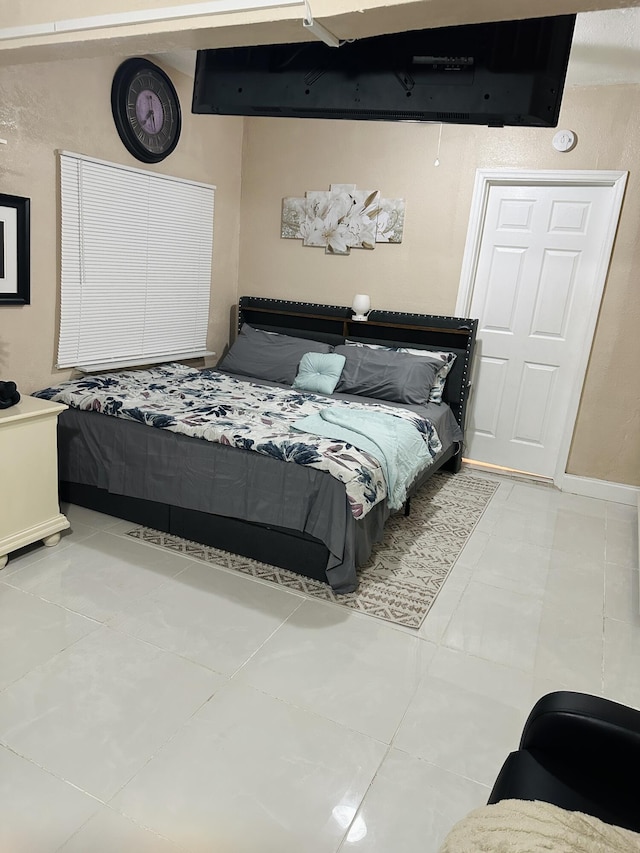 bedroom with tile patterned floors