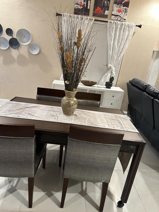 dining area with tile patterned flooring