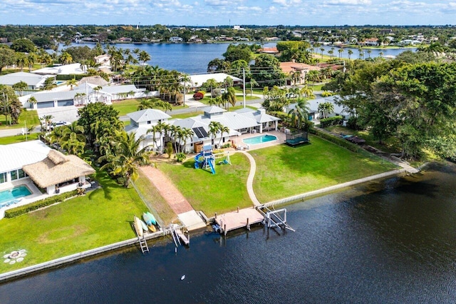 birds eye view of property with a water view