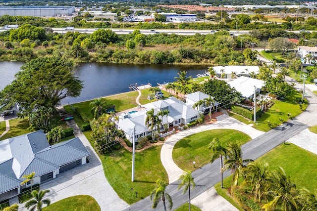 birds eye view of property with a water view