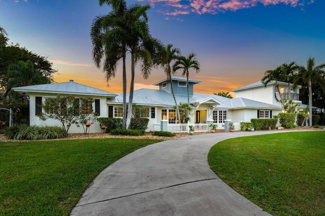 view of front of property with a lawn