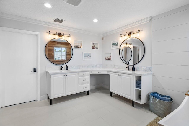 bathroom featuring vanity, a textured ceiling, and ornamental molding