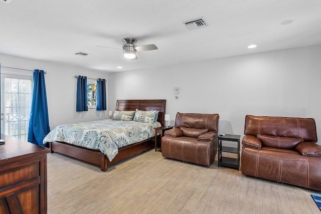 bedroom with light wood-type flooring, ceiling fan, and access to exterior