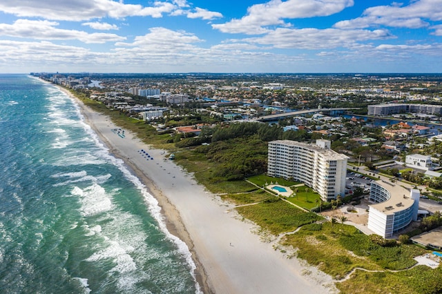 aerial view featuring a view of the beach and a water view