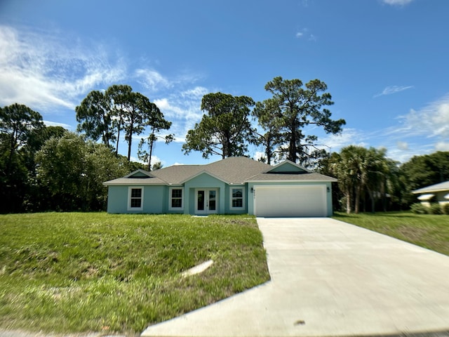 ranch-style home with a front lawn and a garage