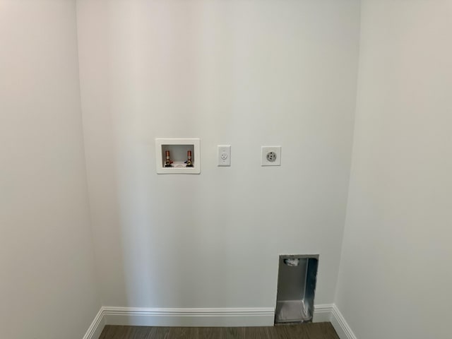 washroom featuring electric dryer hookup, dark hardwood / wood-style flooring, and hookup for a washing machine