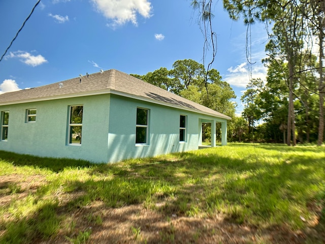 view of home's exterior with a lawn