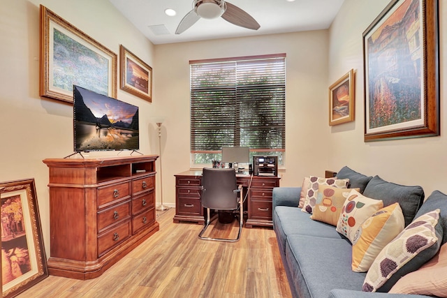 office with ceiling fan and light hardwood / wood-style flooring