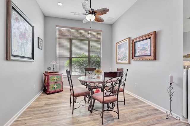 dining area featuring ceiling fan and light hardwood / wood-style flooring