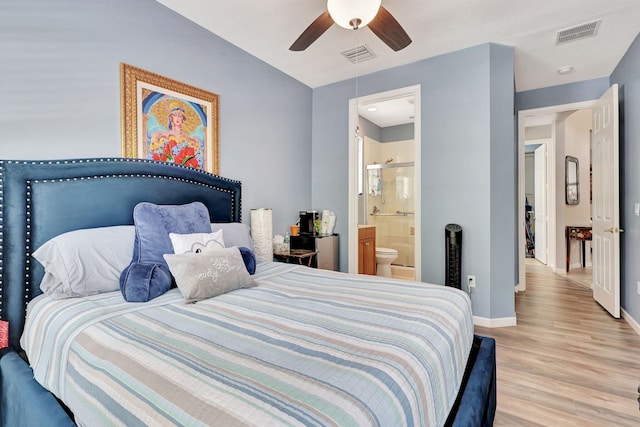 bedroom featuring ensuite bath, ceiling fan, and light hardwood / wood-style flooring