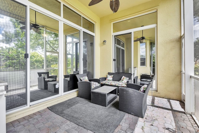 view of patio featuring an outdoor living space and ceiling fan