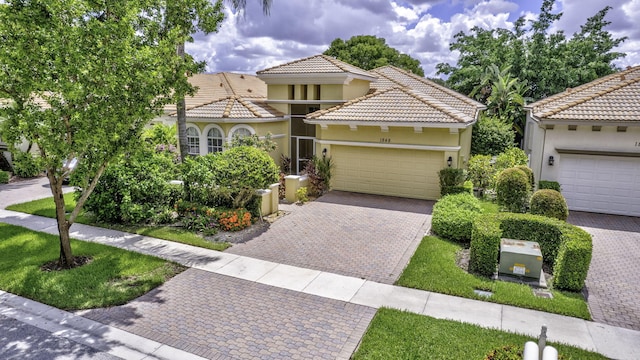 mediterranean / spanish-style house featuring a garage