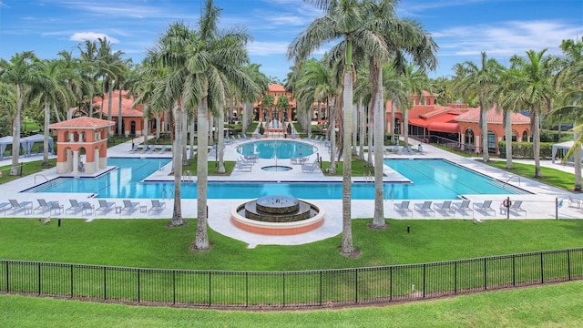 view of pool featuring a yard