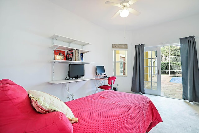 carpeted bedroom featuring access to exterior and ceiling fan