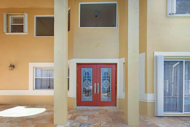 property entrance featuring french doors