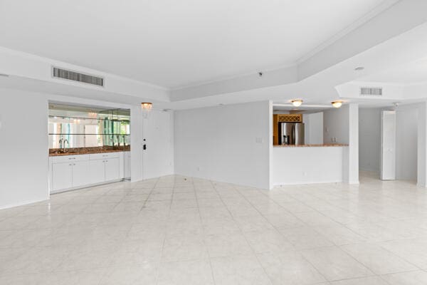 unfurnished room featuring crown molding