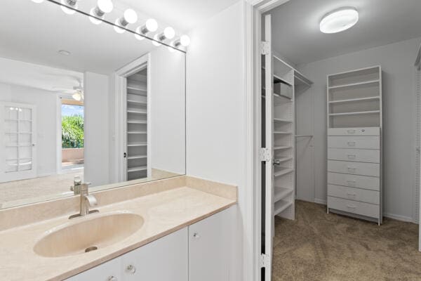 bathroom featuring vanity and ceiling fan