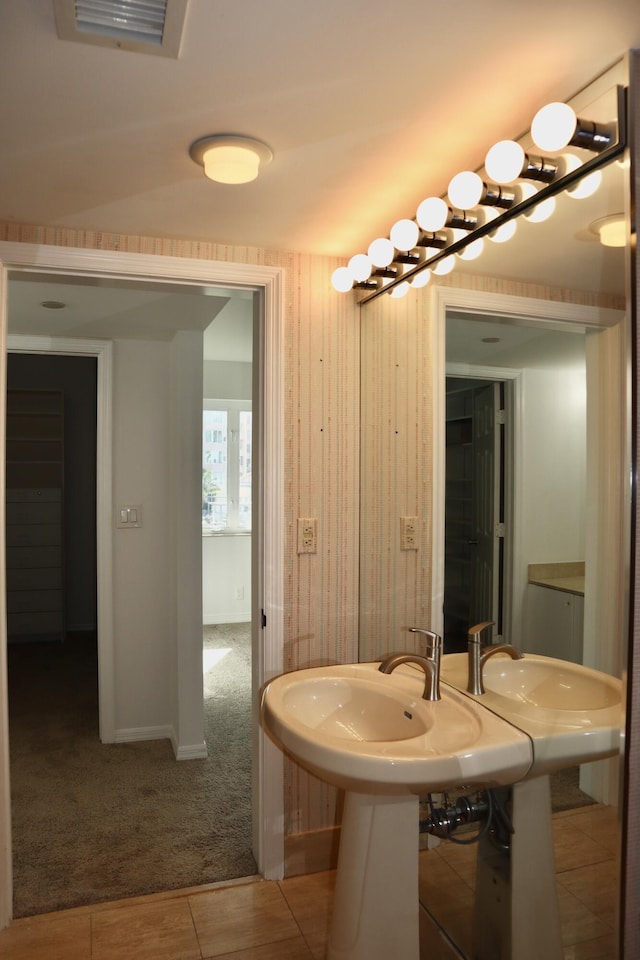 bathroom with tile patterned flooring