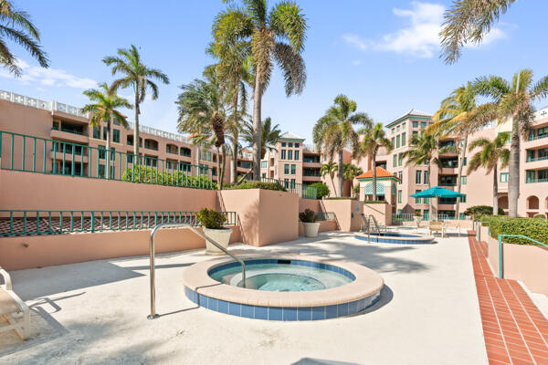 view of swimming pool with a hot tub and a patio