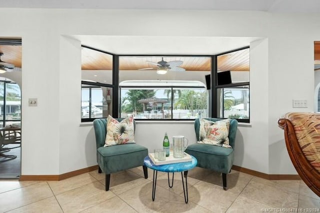 sitting room featuring light tile patterned floors and ceiling fan