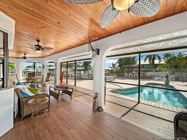 view of pool featuring ceiling fan