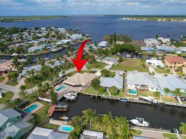 drone / aerial view featuring a water view