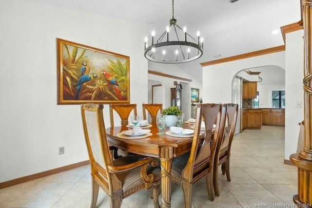 dining room featuring ornamental molding and a notable chandelier