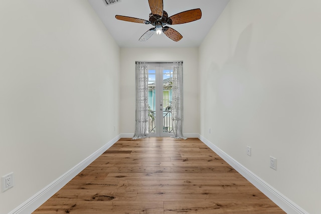 empty room featuring ceiling fan and light hardwood / wood-style flooring