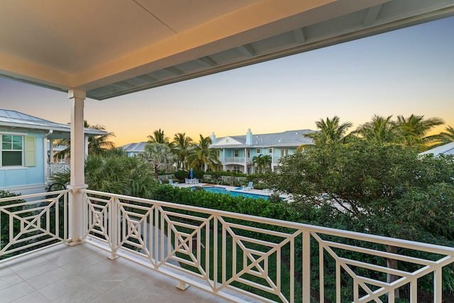 view of balcony at dusk