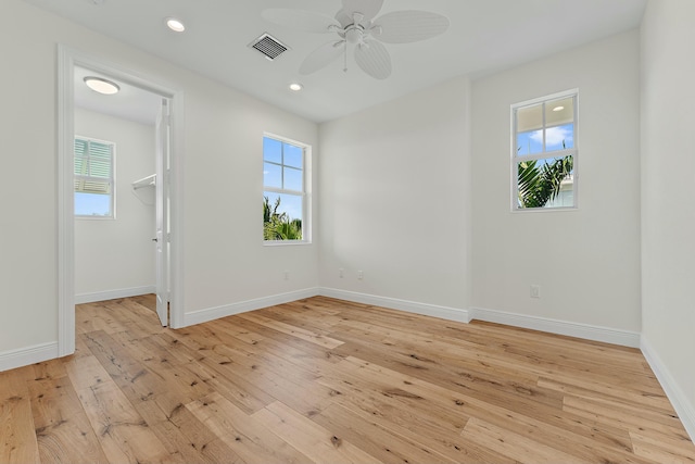 unfurnished room featuring ceiling fan and light wood-type flooring