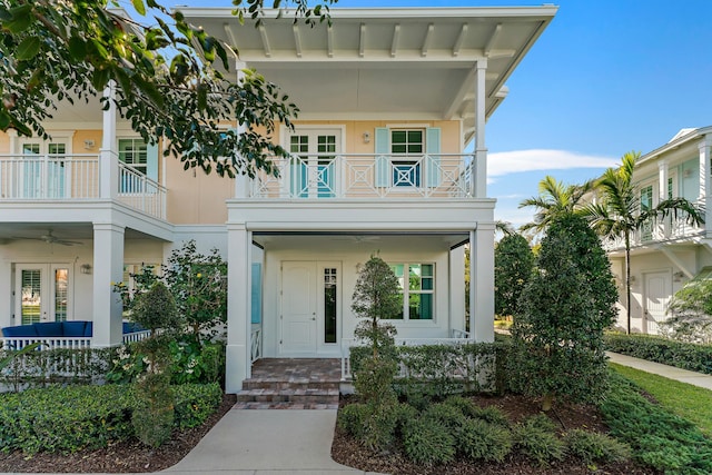 view of front of house featuring covered porch and a balcony