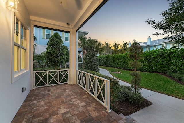 view of patio terrace at dusk