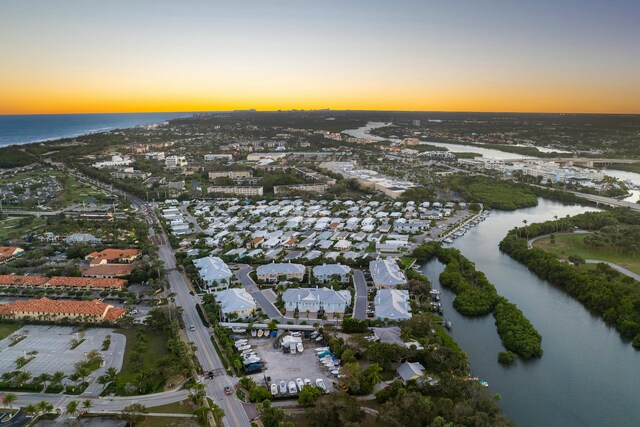 aerial view at dusk with a water view