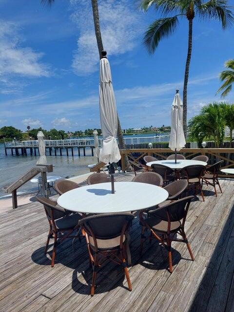 wooden terrace featuring a water view