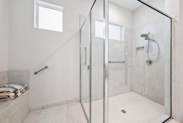 bathroom featuring tile patterned floors and walk in shower