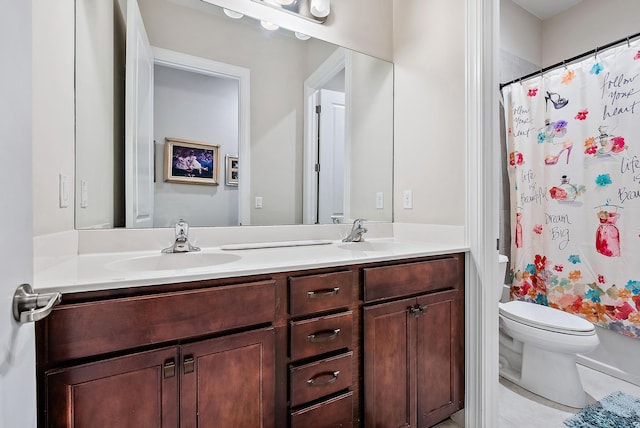 full bathroom with vanity, toilet, and shower / bath combo with shower curtain