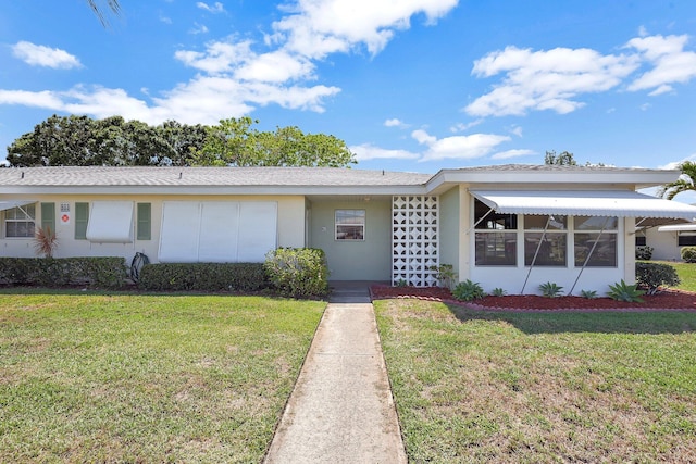 ranch-style house with a front yard